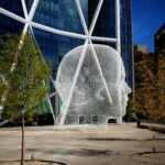 Jaume Plensa's Wonderland sculpture outside The Bow in Calgary